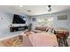 Stylish living room featuring a large sectional, sleek TV console, and an open layout with modern furnishings at 6841 Roxbury Dr, Sarasota, FL 34231
