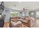 Inviting living room with a spacious sectional, stylish decor, and an open layout at 6841 Roxbury Dr, Sarasota, FL 34231