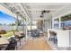 Inviting screened porch with a bar and furniture set at 6841 Roxbury Dr, Sarasota, FL 34231