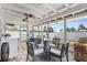 Comfortable screened porch with stylish furniture and dining area at 6841 Roxbury Dr, Sarasota, FL 34231