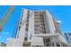Modern condo building under construction featuring bare concrete and blue skies at 688 Golden Gate Point # 701, Sarasota, FL 34236