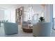 Modern living room featuring an open layout, stylish furniture, and bright, airy ambiance at 688 Golden Gate Point # 701, Sarasota, FL 34236