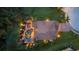 Overhead view of the pool and patio area with lush landscaping surrounding the home at 6907 47Th E Ct, Ellenton, FL 34222