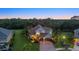 This home features a three-car garage, manicured landscaping and exterior lighting at 6907 47Th E Ct, Ellenton, FL 34222