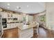 Well-equipped kitchen with granite countertops, a large island, and modern appliances at 6907 47Th E Ct, Ellenton, FL 34222