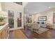 An open living room and entryway features hardwood floors and double-door entry at 6907 47Th E Ct, Ellenton, FL 34222