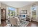 Bright living room with a large window, comfortable seating, and stylish decor at 6907 47Th E Ct, Ellenton, FL 34222