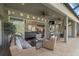 This covered outdoor patio features comfortable seating and access to the home's interior at 6907 47Th E Ct, Ellenton, FL 34222