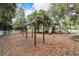Community playground offers a safe play area for with swings and slides amidst a natural setting at 6907 47Th E Ct, Ellenton, FL 34222