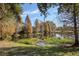 A tranquil pond is surrounded by trees and greenery at 6907 47Th E Ct, Ellenton, FL 34222