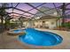 Inviting screened-in pool with a spa and plenty of space for lounging at 6907 47Th E Ct, Ellenton, FL 34222