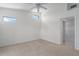 Bright bedroom with neutral carpet, vaulted ceiling, and natural light from above windows at 7035 Scrub Jay Way # 202, Bradenton, FL 34203