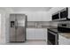 Well-equipped kitchen with stainless steel appliances, granite countertops, and bright white cabinetry at 7035 Scrub Jay Way # 202, Bradenton, FL 34203