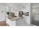 Modern kitchen featuring granite countertops, stainless steel appliances, and white cabinetry at 7035 Scrub Jay Way # 202, Bradenton, FL 34203