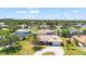 Aerial view of a home with mature landscaping and a well-maintained lawn in a quiet neighborhood at 710 Beverly Rd, Venice, FL 34293