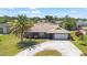 Aerial view showcasing a charming home featuring mature landscaping and a circular driveway at 710 Beverly Rd, Venice, FL 34293