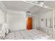 Bedroom featuring a four poster bed frame, light colored walls, and a wood door at 710 Beverly Rd, Venice, FL 34293