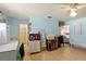 Spacious bedroom featuring light blue walls, hardwood floors and a ceiling fan at 710 Beverly Rd, Venice, FL 34293