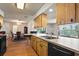 Bright kitchen with dishwasher and open floor plan into the dining area at 710 Beverly Rd, Venice, FL 34293