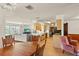 Open floor plan featuring a living room, kitchen with countertop seating, and dining area with chandelier at 710 Beverly Rd, Venice, FL 34293