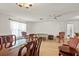 Bright living room with natural light and matching furnishings and adjacent dining area at 710 Beverly Rd, Venice, FL 34293