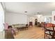 Spacious living room area with wood laminate flooring, and large window at 710 Beverly Rd, Venice, FL 34293