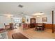 Open concept living and dining area with bar seating and dining table at 710 Beverly Rd, Venice, FL 34293