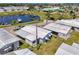 Aerial image of single-Gathering home featuring nearby community marina and landscaping at 714 N Waterway Dr, Venice, FL 34285