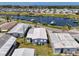 Aerial image of single-Gathering home featuring nearby community marina and landscaping at 714 N Waterway Dr, Venice, FL 34285