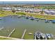 Wide aerial view highlighting waterfront community and marina with docks and boats at 714 N Waterway Dr, Venice, FL 34285
