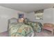 Bedroom featuring two twin beds, side table, and carpeted floors at 714 N Waterway Dr, Venice, FL 34285