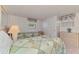 Bedroom featuring two twin beds, a dresser, and carpeted floors at 714 N Waterway Dr, Venice, FL 34285
