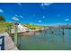 Community boat ramp with access to the marina, featuring sturdy wooden pilings at 714 N Waterway Dr, Venice, FL 34285