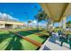 Bocce ball courts surrounded by benches and lush landscaping, creating a tranquil and inviting outdoor space at 714 N Waterway Dr, Venice, FL 34285