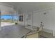Covered carport of a single Gathering home with outdoor seating at 714 N Waterway Dr, Venice, FL 34285
