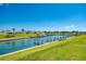 Beautiful view of the community marina with docks and lush green spaces at 714 N Waterway Dr, Venice, FL 34285