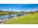 Picturesque community marina with well-maintained boat docks and lush green spaces at 714 N Waterway Dr, Venice, FL 34285