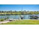Scenic view of the community marina with boat docks and well-maintained lawns at 714 N Waterway Dr, Venice, FL 34285