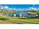 Beautiful waterfront community marina featuring boat docks surrounded by lush greenery at 714 N Waterway Dr, Venice, FL 34285