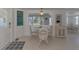 Well-lit dining area offers a cozy spot for meals with outdoor view at 714 N Waterway Dr, Venice, FL 34285