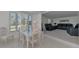 Dining area featuring window views and wicker furniture, providing natural light and charm at 714 N Waterway Dr, Venice, FL 34285