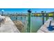 Picturesque waterfront scene with a dock, boat slips, and beautiful water views, perfect for boating enthusiasts at 714 N Waterway Dr, Venice, FL 34285
