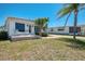 Cozy single story home featuring a small patio and well kept lawn at 714 N Waterway Dr, Venice, FL 34285