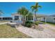 Attractive single story home with brick pathway leading to the front door at 714 N Waterway Dr, Venice, FL 34285