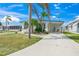 Charming single-story home with well-maintained lawn and tropical landscaping, perfect for relaxing in a sunny location at 714 N Waterway Dr, Venice, FL 34285