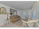 This living room has a nice view, couch, mirror, and tiled flooring at 714 N Waterway Dr, Venice, FL 34285