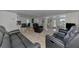Open floor plan with bar-style seating and dining leading into the comfortable living room at 714 N Waterway Dr, Venice, FL 34285
