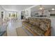 Open living space with a view into the kitchen and dining area, featuring comfortable seating at 714 N Waterway Dr, Venice, FL 34285