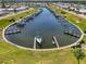 Aerial view of the community marina with boat docks and water access at 714 N Waterway Dr, Venice, FL 34285