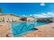 Large outdoor pool with clear blue water, poolside seating, and a building in the background on a sunny day at 714 N Waterway Dr, Venice, FL 34285